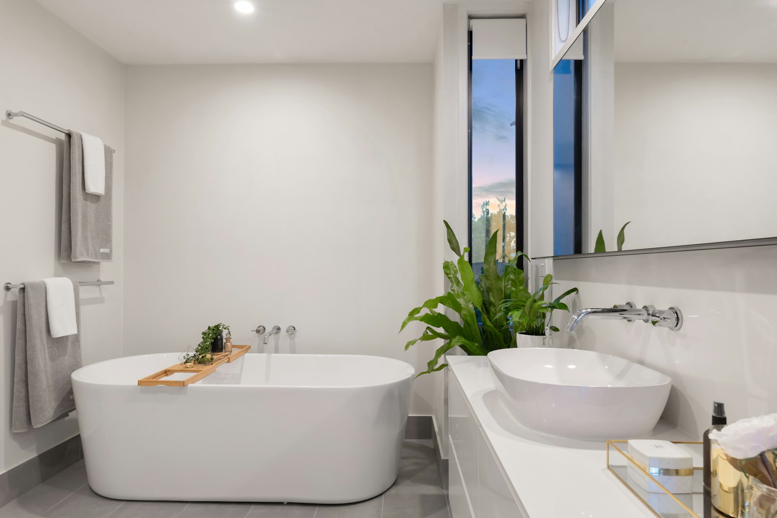 Luxury bathroom with freestanding tub and stone floors